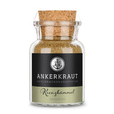 Kreuzkümmel Gemahlen von Ankerkraut im Korkenglas auf weißem Hintergrund.